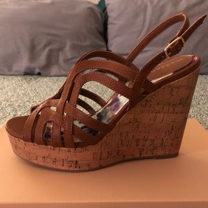 Brown strappy wedges with adjustable ankle strap.